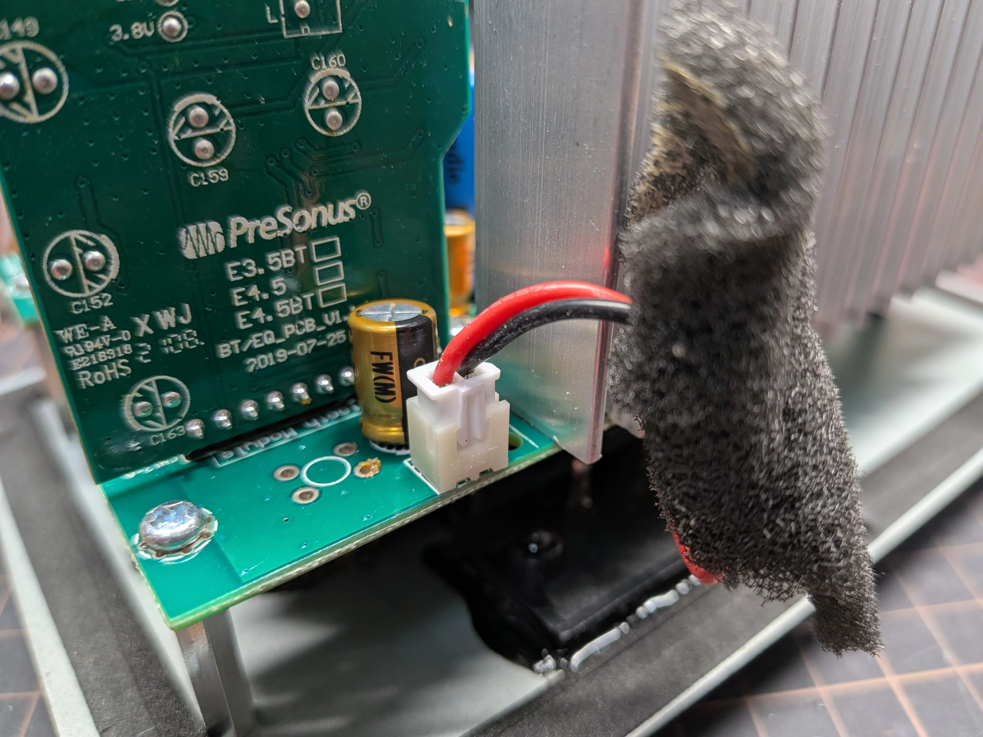 Close-up of replaced capacitors on the PCB