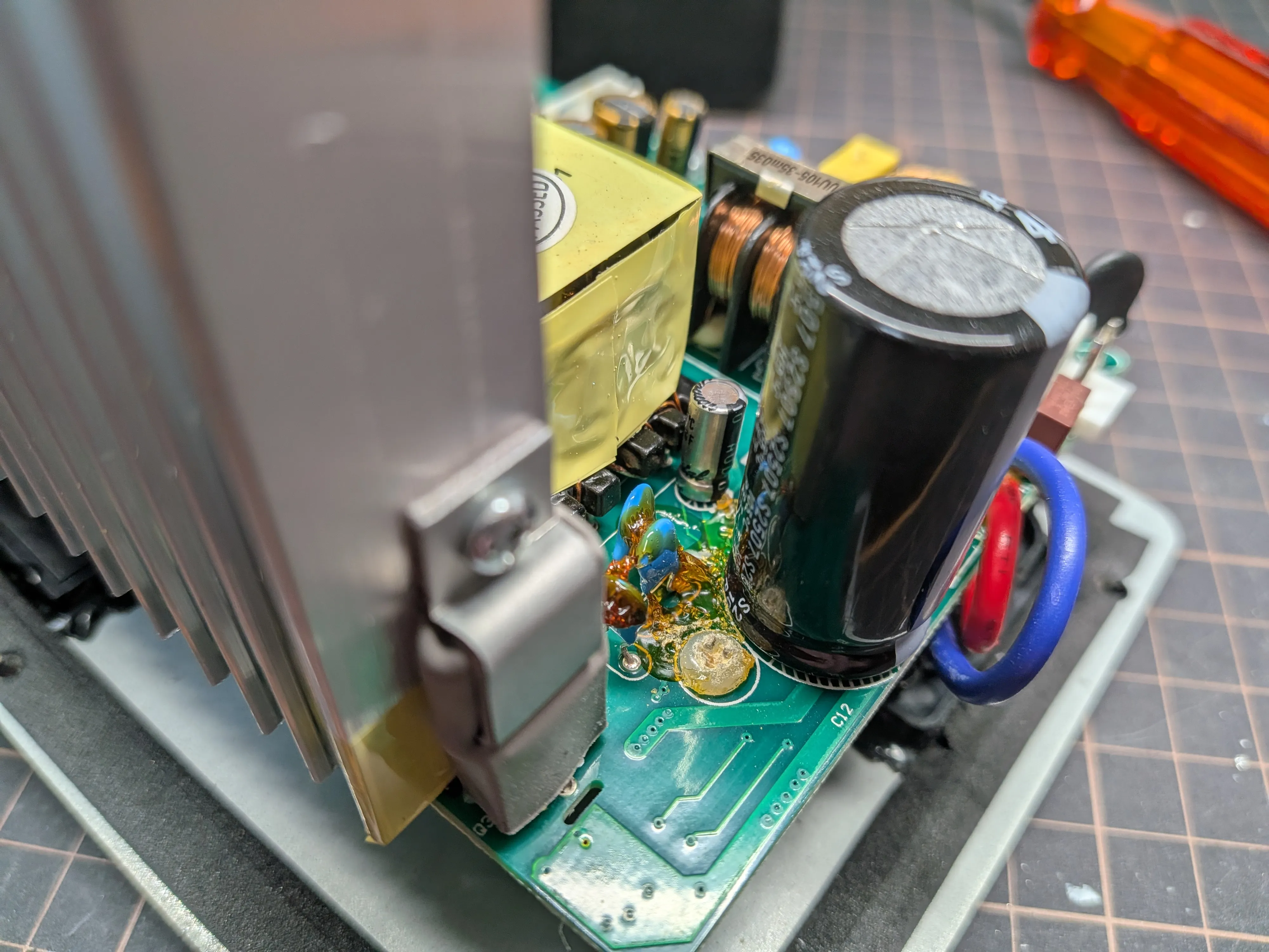Close-up of replaced capacitors on the PCB